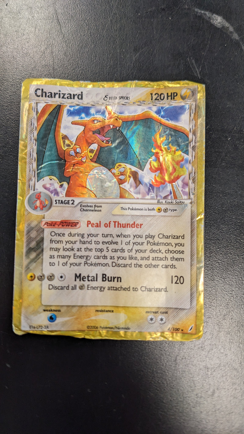 Charizard Delta Species (4/100) Water Damaged